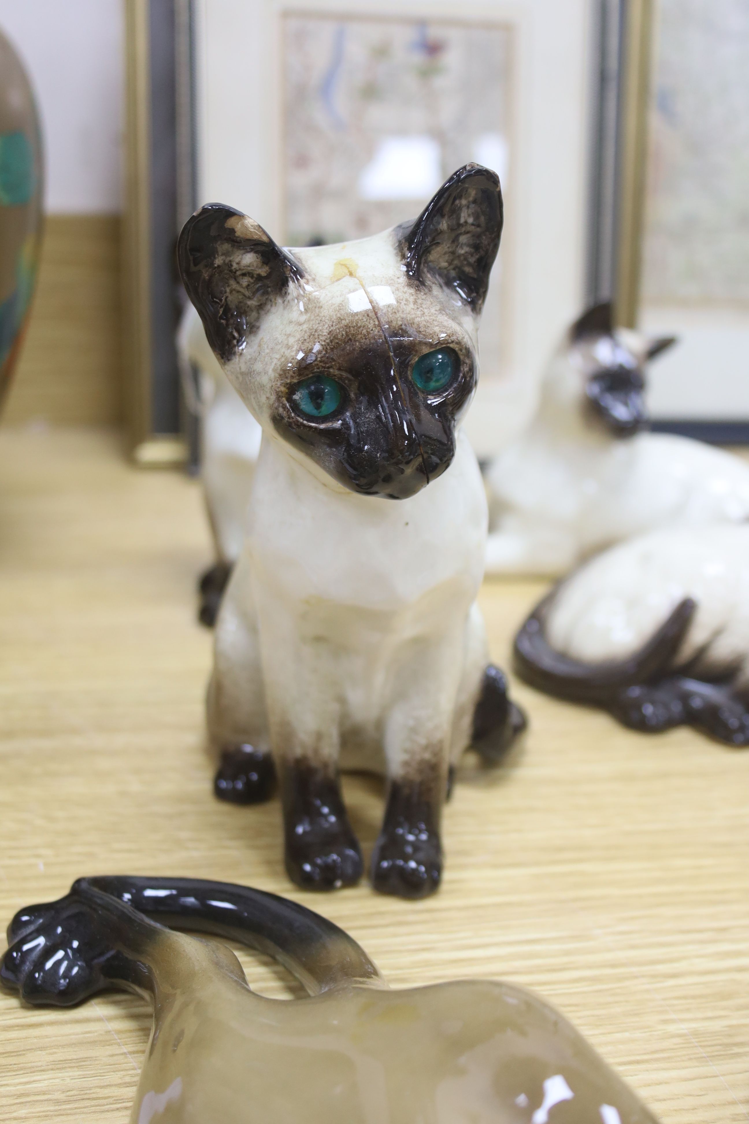 Twelve Beswick cats including Siamese